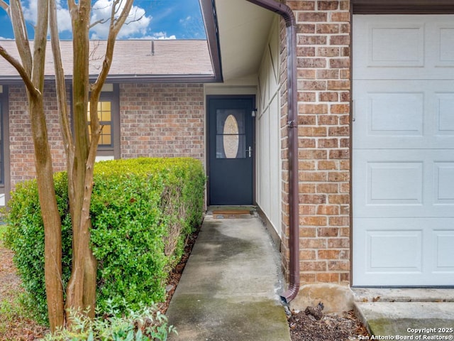 doorway to property featuring a garage