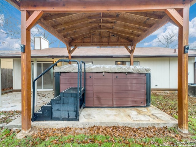 exterior space with a hot tub