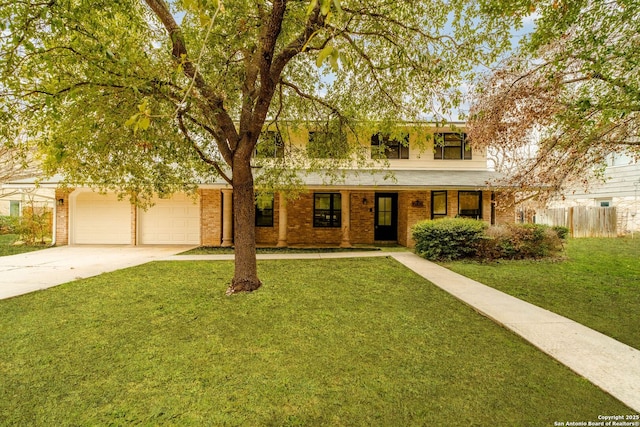 view of front facade with a garage and a front yard