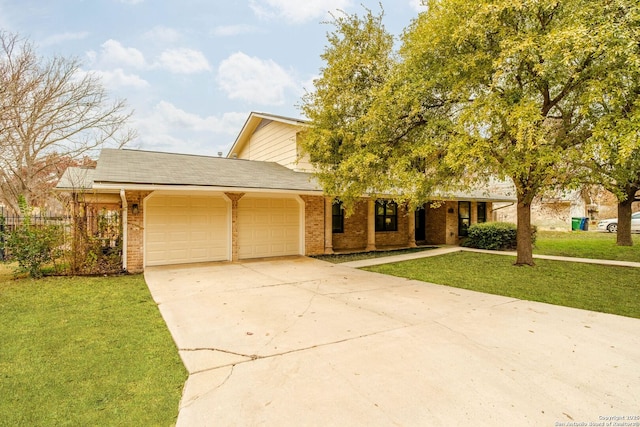 view of front of house with a garage and a front lawn