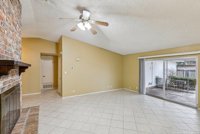 unfurnished living room featuring light tile patterned floors, ceiling fan, a textured ceiling, a brick fireplace, and vaulted ceiling