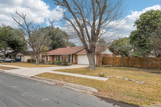 view of front facade with a garage and a front lawn