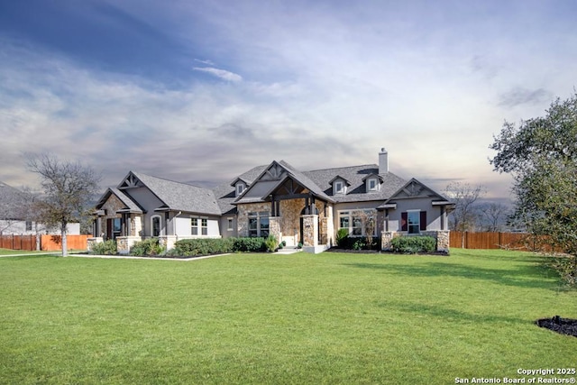 view of front of property with a lawn