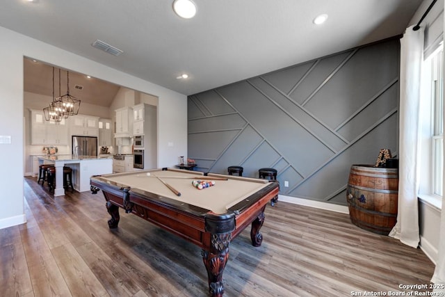 playroom with lofted ceiling, pool table, and light hardwood / wood-style floors