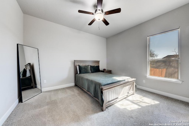 bedroom featuring light carpet and ceiling fan