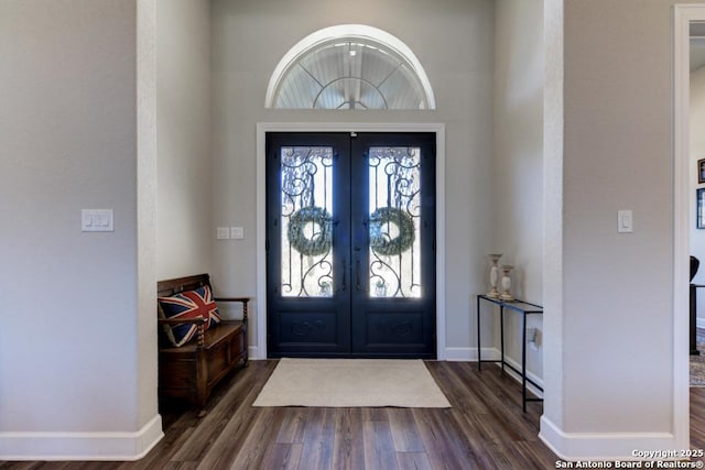 entrance foyer featuring dark wood-type flooring and french doors