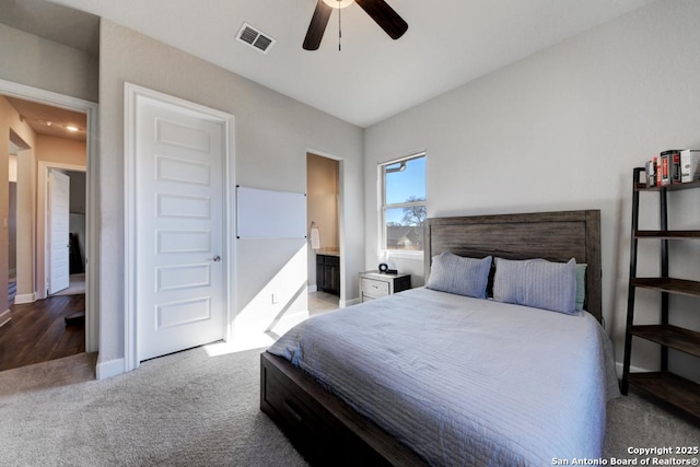 carpeted bedroom featuring connected bathroom and ceiling fan