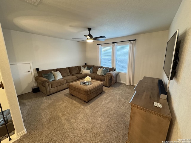 carpeted living room with ceiling fan