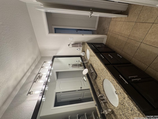 kitchen with tasteful backsplash and stone countertops