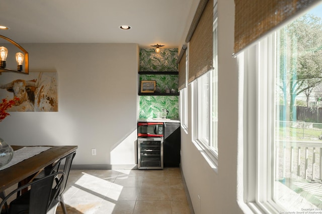 office featuring light tile patterned floors and beverage cooler