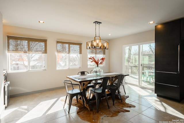 dining space featuring light tile patterned floors