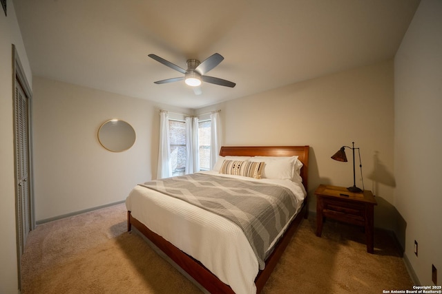 bedroom with ceiling fan and carpet flooring