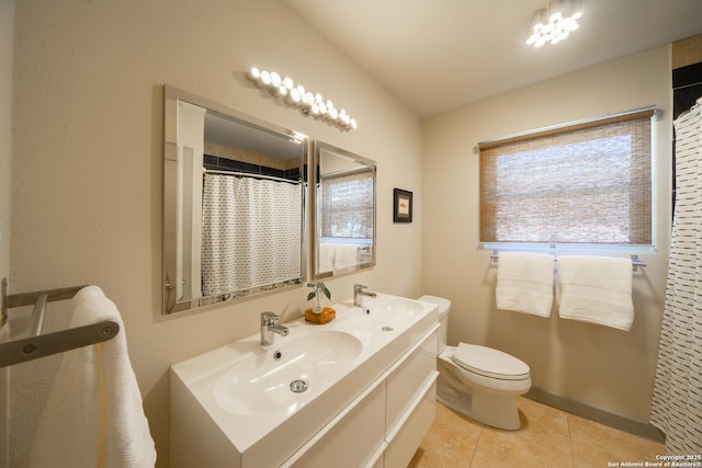 bathroom featuring a shower with shower curtain, vanity, toilet, and tile patterned flooring