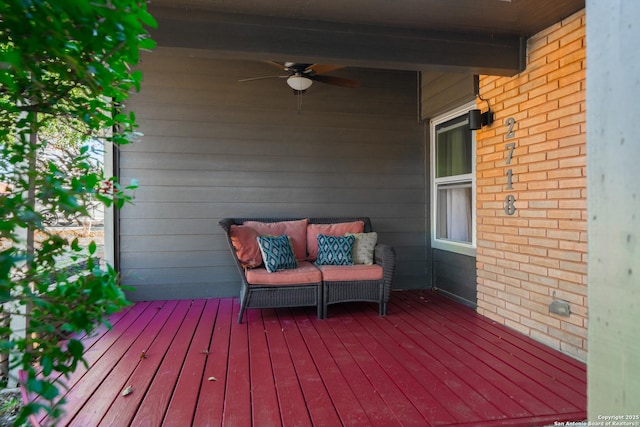 wooden deck featuring ceiling fan