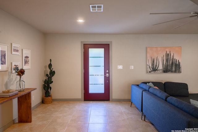 foyer featuring ceiling fan and light tile patterned flooring