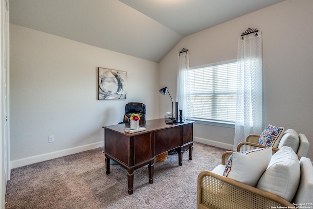 office space featuring lofted ceiling and light colored carpet