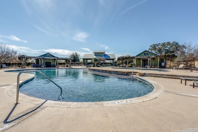 view of pool featuring a patio and a pergola