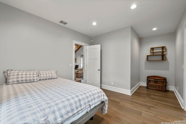 bedroom featuring hardwood / wood-style floors