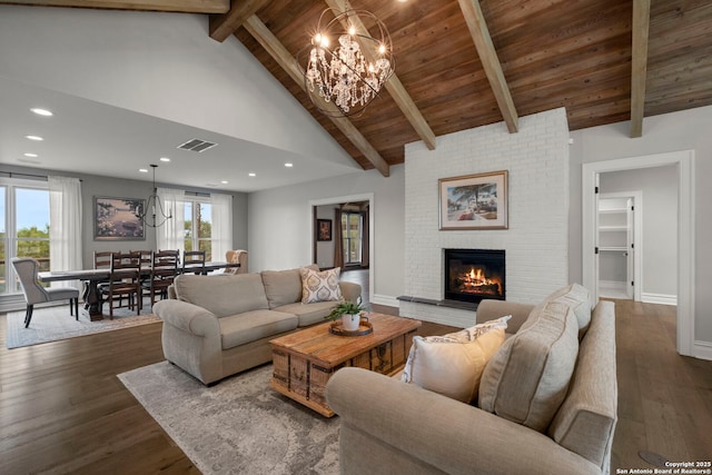 living room featuring high vaulted ceiling, a fireplace, beamed ceiling, dark hardwood / wood-style flooring, and wood ceiling