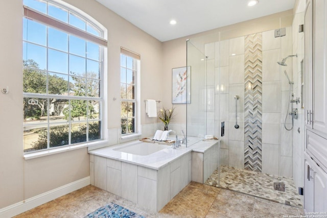 bathroom featuring tile patterned floors, a healthy amount of sunlight, and shower with separate bathtub