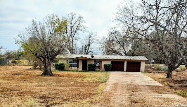 ranch-style house featuring a garage