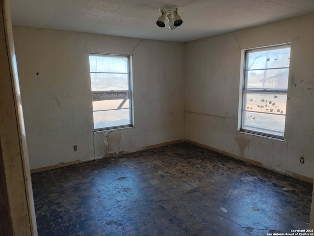 empty room featuring a wealth of natural light