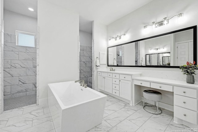 bathroom featuring vanity and shower with separate bathtub