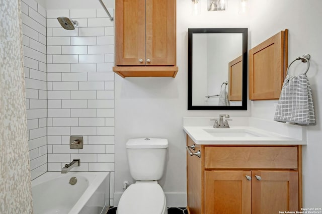 full bathroom featuring tiled shower / bath combo, vanity, and toilet