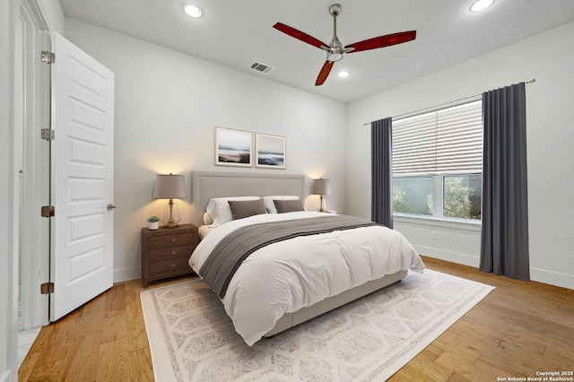 bedroom featuring light hardwood / wood-style flooring and ceiling fan