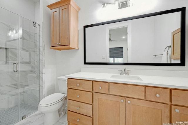 bathroom featuring vanity, an enclosed shower, ceiling fan, and toilet