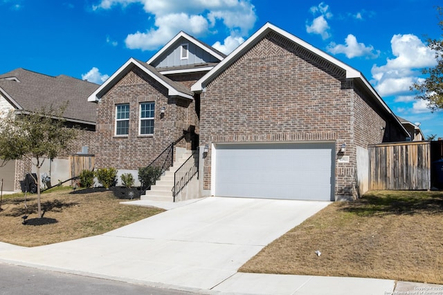 view of front facade with a garage and a front yard