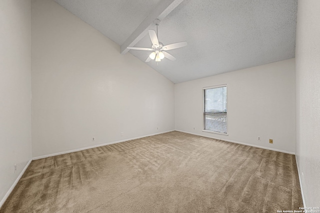 unfurnished room with lofted ceiling with beams, carpet floors, a textured ceiling, and ceiling fan