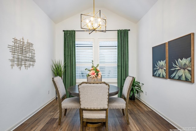 dining area with dark hardwood / wood-style flooring, a notable chandelier, and vaulted ceiling