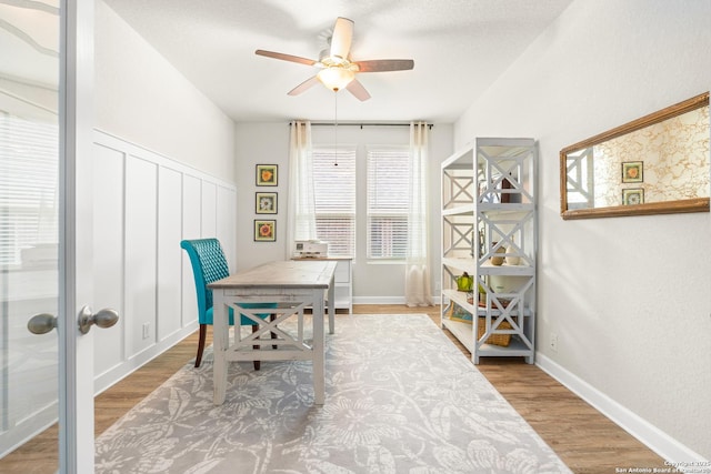 office space with hardwood / wood-style flooring and ceiling fan