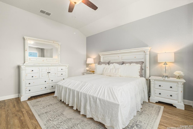 bedroom featuring lofted ceiling, light hardwood / wood-style floors, and ceiling fan