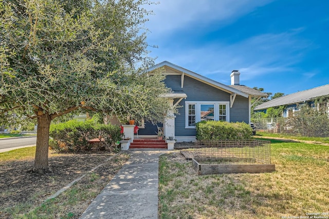 view of front of property with a front lawn