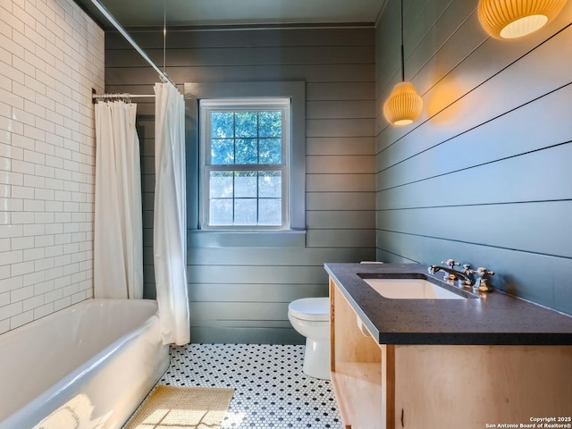 full bathroom featuring tile patterned flooring, shower / bath combo, vanity, and toilet