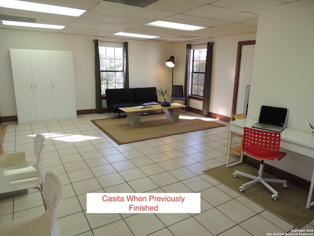 tiled office with a wealth of natural light and a paneled ceiling