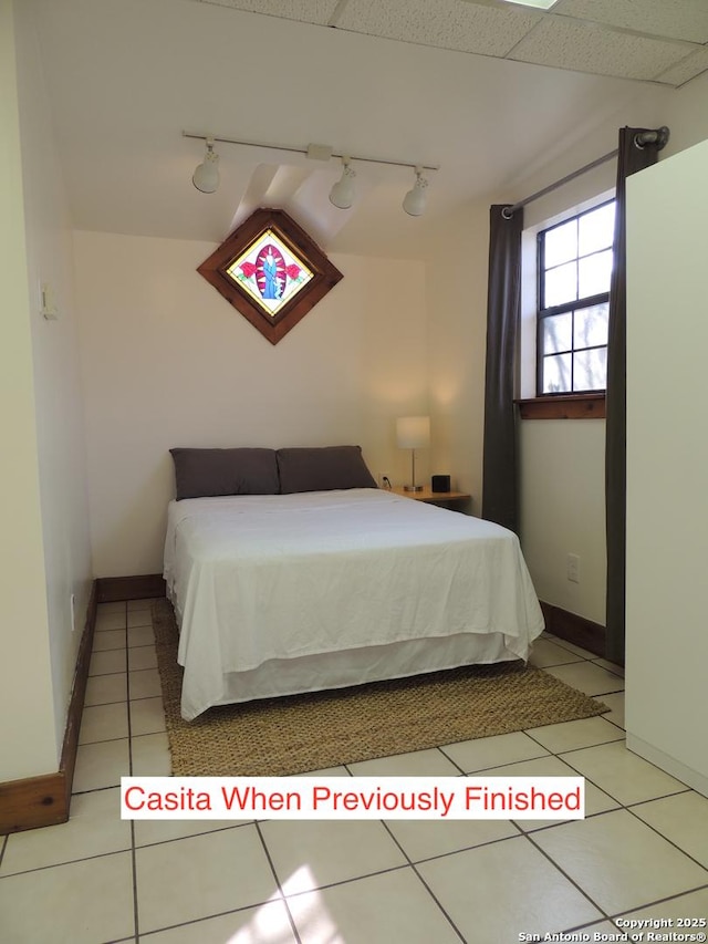 bedroom featuring light tile patterned floors