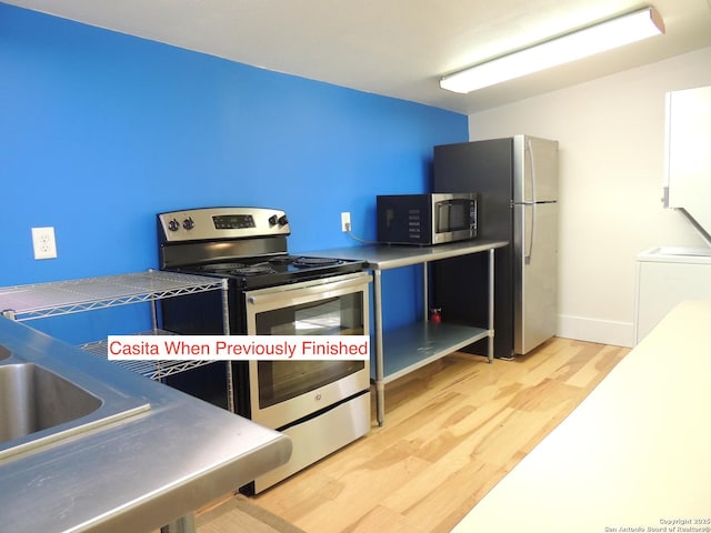 kitchen with washer / dryer, light hardwood / wood-style flooring, and stainless steel appliances