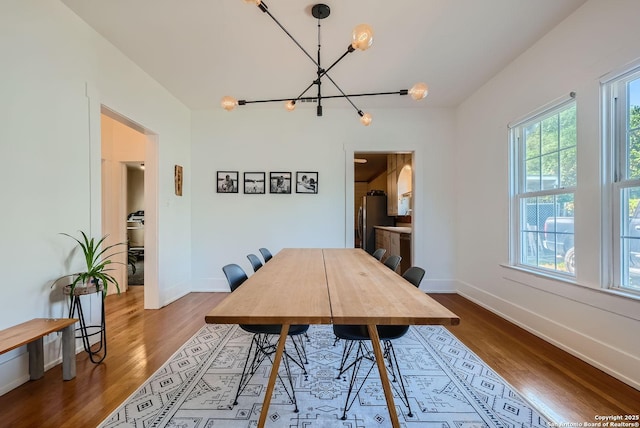 dining area with a chandelier and hardwood / wood-style floors