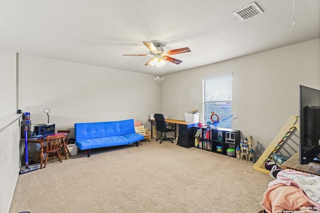 playroom with ceiling fan and carpet flooring