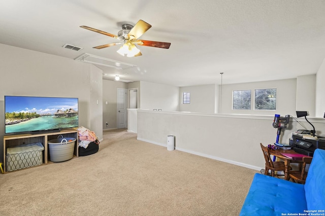 recreation room with light carpet and ceiling fan