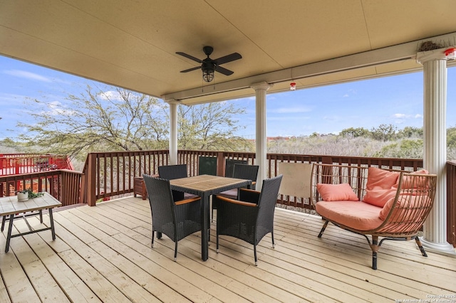 wooden terrace featuring ceiling fan