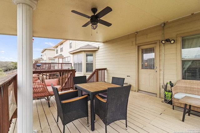 wooden deck featuring ceiling fan