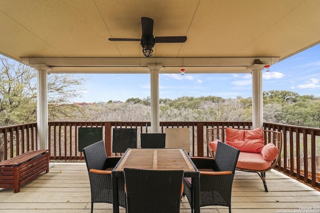 wooden deck featuring ceiling fan