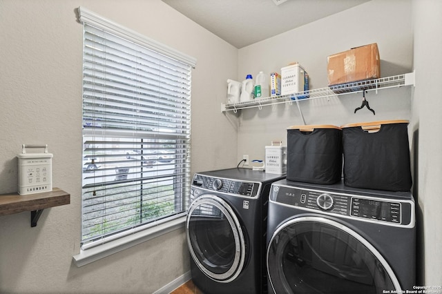 washroom featuring washing machine and clothes dryer