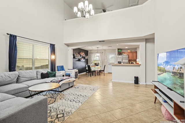 tiled living room with an inviting chandelier