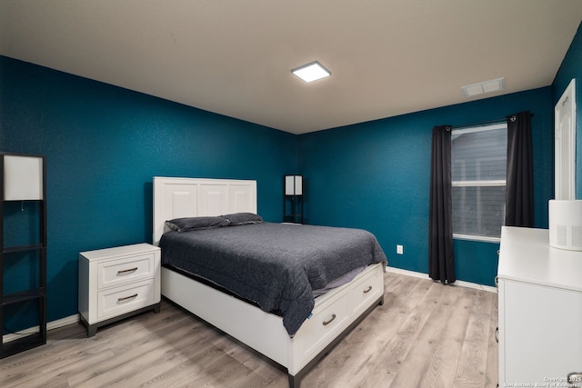 bedroom with light hardwood / wood-style floors