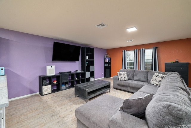 living room with light hardwood / wood-style flooring